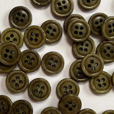 11mm Olive green stained glossy buttons, bone material, scattered on a surface.