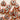 Heart-shaped ceramic tiles with decorative patterns on a light background
