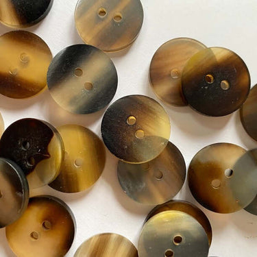 18mm Natural Horn Button (J4) with unique color variations and natural patterns, perfect for sewing and crafting projects.