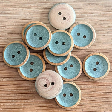 18mm Pearly Green centre wood buttons (K2) with a pearly metallic finish and green color, perfect for crafts and sewing projects.