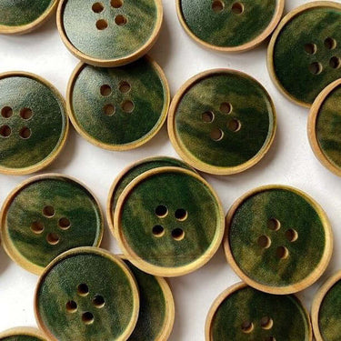 20mm Streaky Green Wood Buttons (K1) with streaky green center and four holes, perfect for crafting and sewing projects.