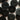 Multiple black buttons on a light background