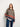 Model wearing a sweater from 52 Weeks of Sweaters knitting book collection, available for pre-order.