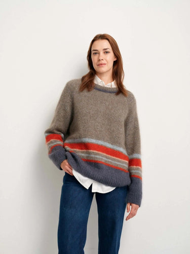 Model wearing a sweater from 52 Weeks of Sweaters knitting book collection, available for pre-order.