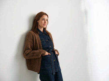 Model wearing a cozy sweater, featured in the 52 Weeks of Sweaters knitting book available for pre-order.