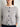 Model wearing gray cardigan featured in 52 Weeks of Sweaters knitting book pre-order