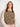 Woman wearing a knitted vest from 52 Weeks of Sweaters book, available for pre-order now.