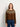 Model wearing sweater featured in 52 Weeks of Sweaters knitting book pre-order, showcasing intricate knit pattern and design.