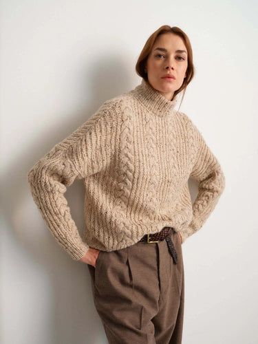 Model wearing a cozy knit sweater from 52 Weeks of Sweaters pre-order collection.