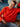 Model wearing bright red sweater from 52 Weeks of Sweaters knitting book, available for pre-order with February 2026 publication.