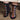 Black socks with colorful floral patterns worn by a person, standing on a carpeted floor.