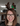 Wool shop owner smiling with antlers
