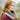 Woman wearing colorful Ennerdale Cowl Kit by Marie Wallin, showcasing intricate Fairisle knitting design from Westmorland collection