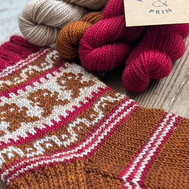 Gingerbread Man Sock Kit with yarn skeins, perfect Festive Gift for Knitters by Nicola Furey and The Knitting Shed collaboration.