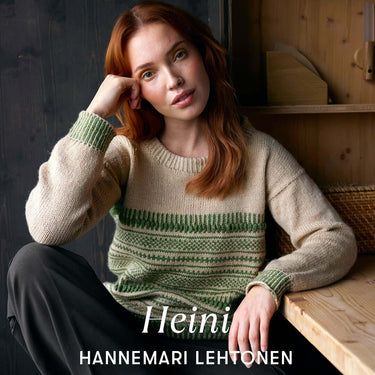 Woman wearing a knitted sweater sitting indoors for Archipelago Knitting pre-order campaign.