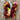 Two skeins of multicolored yarn on a wooden surface