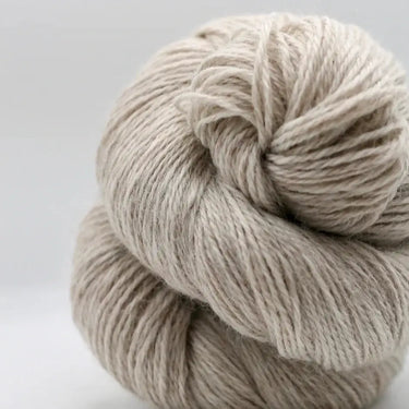 Yarnadelic Sport 100% Falklands Corriedale yarn skein, ideal for knitting projects with a balance of softness and durability.