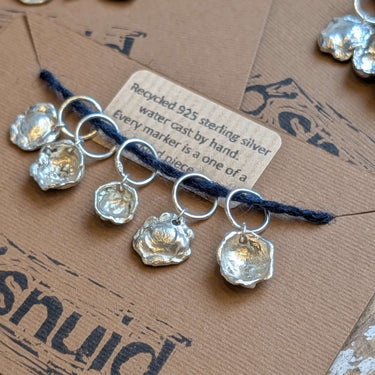 Handcrafted Silver Stitch Markers on brown card, recycled 925 silver, unique water cast design.