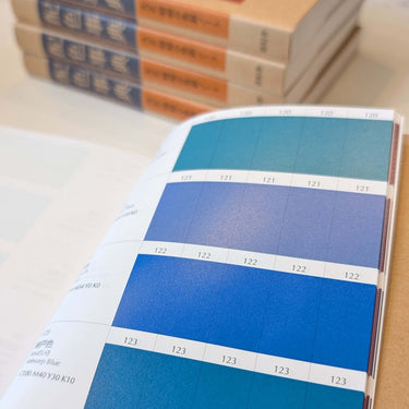 Open page of The Japanese Dictionary of Colour Combinations by Sanzo Wada showing various blue color swatches.