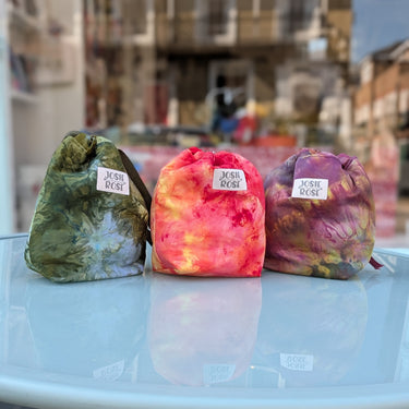 Colorful Ice Dyed Project Knitting Bags by Josie Rose on display table