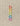 Cocoknits Round Stitch Markers in rainbow colors on a beige surface, perfect for knitting projects.