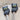 Stitch Stoppers cat design by Fox & Pine Stitches on knitting needles, preventing stitches from coming undone, essential knitting tool.