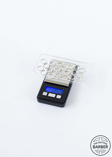 Digital Pocket Scale on white background, displaying 75.3 grams, with hexagonal tray, ideal for weighing yarn up to 200 grams.