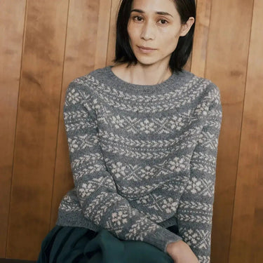 Model wearing Amirisu Assemblage Vol. 2 top-down sweater with floral pattern in gray and white.