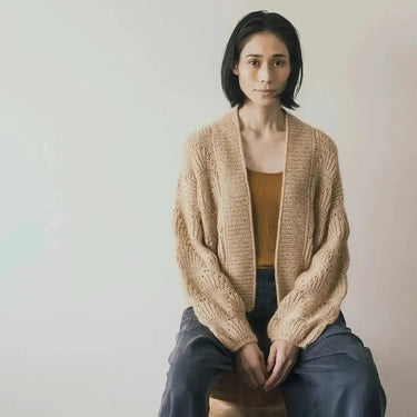 Model wearing a knitted sweater, featured in Amirisu Assemblage Vol. 2 collection.