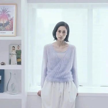 Model wearing a knitted top-down sweater from Amirisu Assemblage Vol. 2 collection, showcasing a unique three-dimensional design technique.