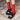 Vibrant red socks featured in Amirisu Sock Knitting Club pattern book, showcased with stylish black loafers.