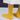 Amirisu Sock Knitting Club yellow textured lace pattern socks worn by a model.