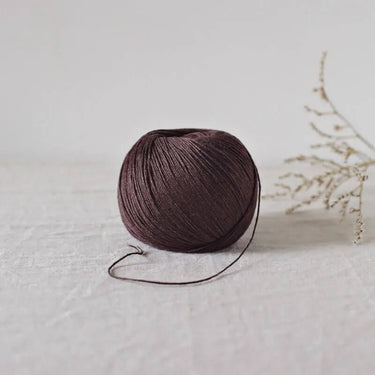 De Rerum Natura | Antigone Yarn | Silky Linen for Summer, Colour: Feve Tonka, De Rerum Natura Antigone is 100% linen yarn with a silky, cool feel. Perfect for summer knits like tops and cardigans. Naturally grown flax. Shop eco yarns now, Knit With Me