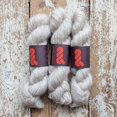 A&P Lace Silk Mohair yarn skeins in soft beige color, showcasing luxurious, fluffy texture and hand-dyed quality.