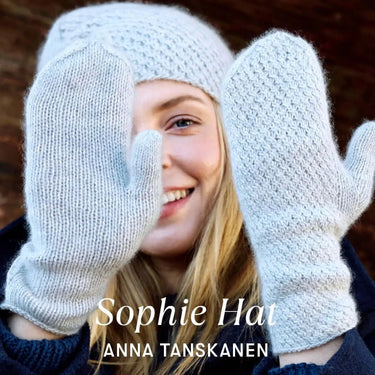Woman wearing knitted Sophie Hat and gloves by Anna Tanskanen