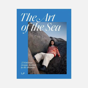 Book cover of 'The Art of the Sea' with a person sitting on rocks.