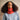 Model wearing a knitted cowl from 'Beaded Colourwork: A Modern Approach to Knitting with Beads' by Jeanette Sloan