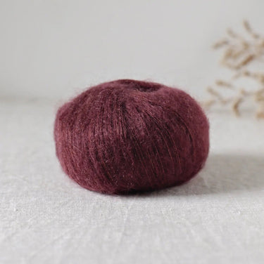 Bérénice lace weight yarn made from extra-fine Angora goat fibres and organic Merinos d'Arles with shiny silk yarn, eco-friendly dyed.