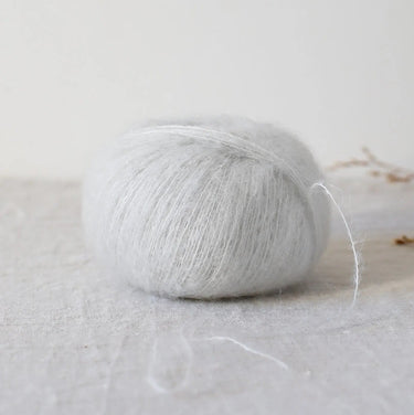 Bérénice lace weight yarn made from Angora goat fibres and Merinos d'Arles wool with shiny silk, dyed with ecological dyes.