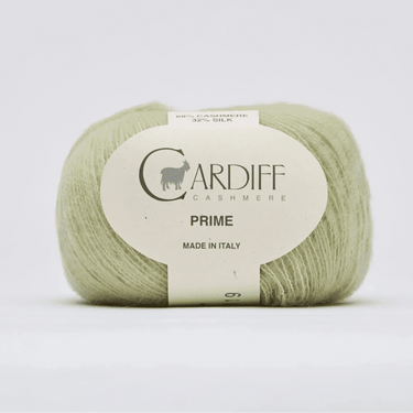 Ball of green yarn with a Cardiff Cashmere label on a white background