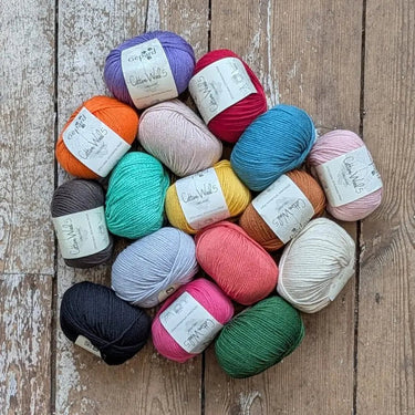 Gepard Cotton Wool 5 balls of yarn on the floor of Knit With Me yarn shop