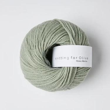 Knitting for Olive Heavy Merino yarn ball in soft green shade, 100% natural Merino wool from New Zealand, eco-friendly and mulesing-free.