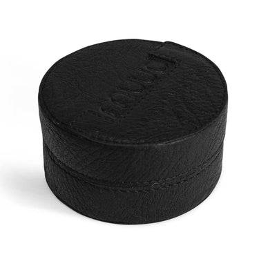 Black leather container with Muud printed on it, in a white background