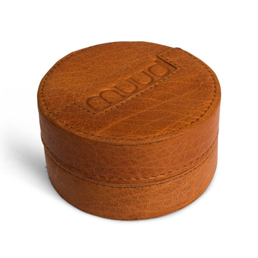 Brown leather ring box with 'Muud' branding on a white background