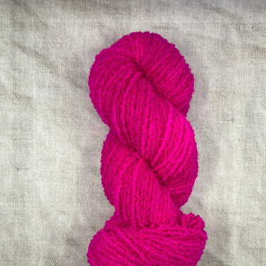 Wild Atlantic | Eriu | Super Soft Merino, Colour: Fushia Pop, Ériu ("air-oo") is a super soft merino yarn. The boucle texture makes it incredibly versatile, allowing it to be a substitute yarn in patterns calling for DK or worsted weights, adding a beauti