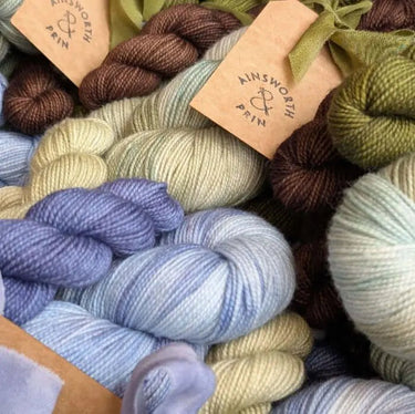 Ainsworth & Prin Flower Yarn Knitting kits featuring colorful skeins with silk ribbon.
