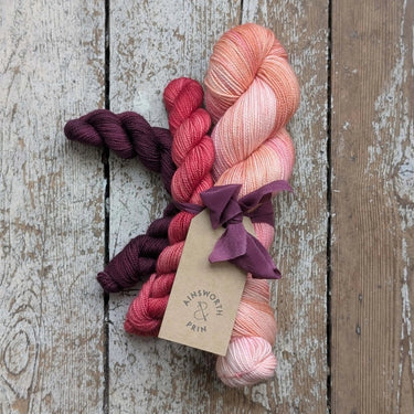Flower Yarn Knitting Kits by Ainsworth & Prin featuring colorful skeins and silk ribbon.