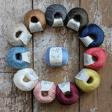 Gepard HorSilke balls of yarn on a floor in Knit With Me yarn shop