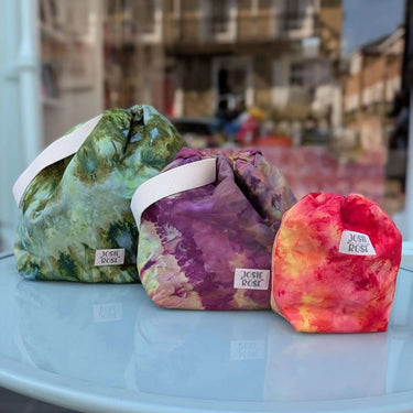 Three ice dyed cotton Jose Rose Knitting Bags in green, purple, and orange, featuring a small size perfect for craft projects.