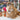 Fluffy Inkari Stuffed Alpaca Animal in a yarn store setting